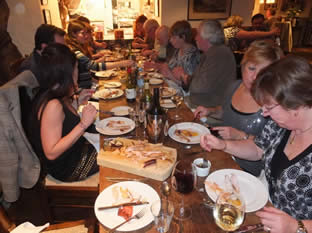 Guests on a smoking coursetucking in to a feast