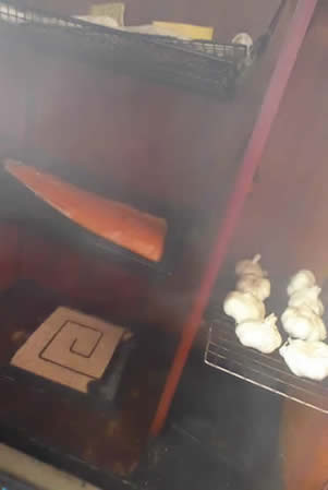 ProQ artisan cold smoke generator in  a wardrobe smoking salmon cheeses and garlic